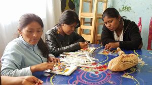 Three of the women concentrating on bingo