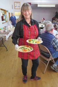 Volunteer Sharon delivering an order